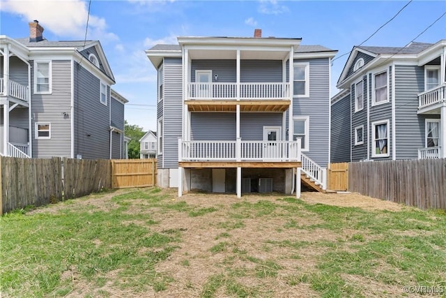 2013 N Ave, Richmond, VA 23222 - back of house featuring a fenced backyard, a chimney, and stairway