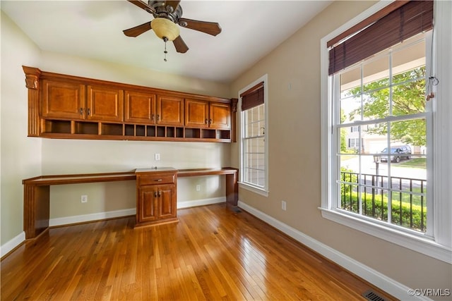 706 Colony Oak Ln, Midlothian, VA 23114 - kitchen with built in desk, healthy amount of natural light, wood-type flooring, and open shelves