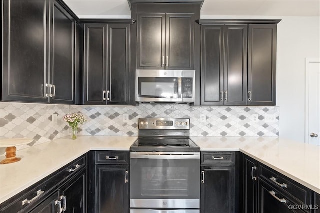 8034 Wistar Glen Dr Unit A, Henrico, VA 23228 - kitchen with stainless steel appliances, dark cabinets, and light countertops