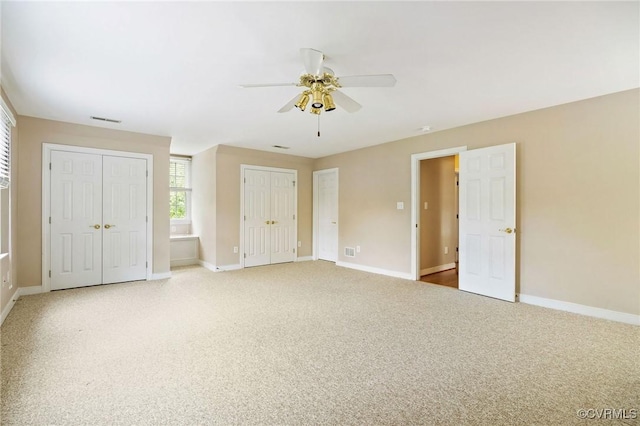 9408 Arrowdel Rd, Henrico, VA 23229 - unfurnished bedroom featuring two closets, carpet floors, and a ceiling fan
