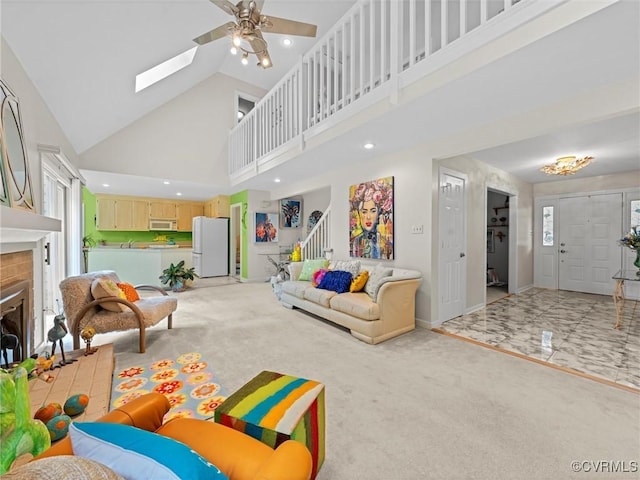 1203 Wesanne Ln, Chesterfield, VA 23114 - living area with high vaulted ceiling, a fireplace with raised hearth, stairs, carpet, and ceiling fan