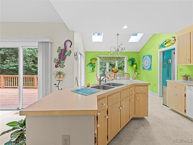 1203 Wesanne Ln, Chesterfield, VA 23114 - kitchen featuring a skylight, light countertops, a center island with sink, plenty of natural light, and lofted ceiling