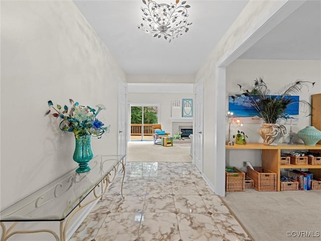 1203 Wesanne Ln, Chesterfield, VA 23114 - hallway with a chandelier and marble look tile flooring