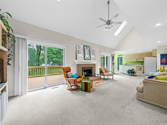 1203 Wesanne Ln, Chesterfield, VA 23114 - living area featuring high vaulted ceiling, light colored carpet, a brick fireplace, a ceiling fan, and a skylight