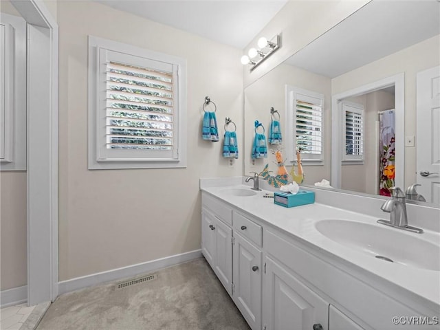 1203 Wesanne Ln, Chesterfield, VA 23114 - full bath featuring double vanity and baseboards