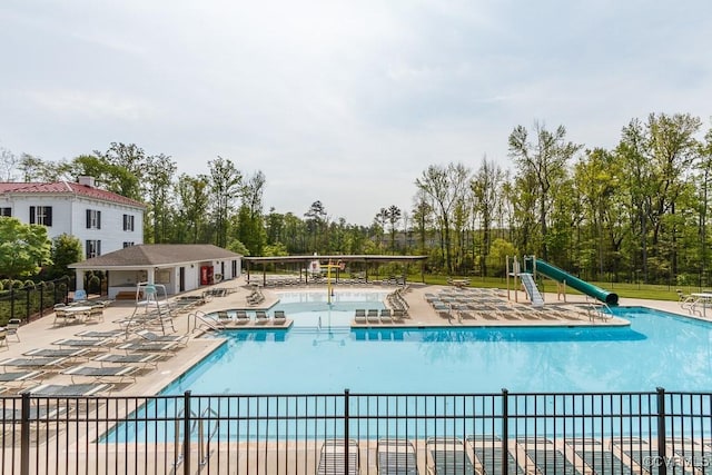 8013 Rutland Village Dr, Mechanicsville, VA 23116 - community pool featuring a patio, view of scattered trees, and a water slide