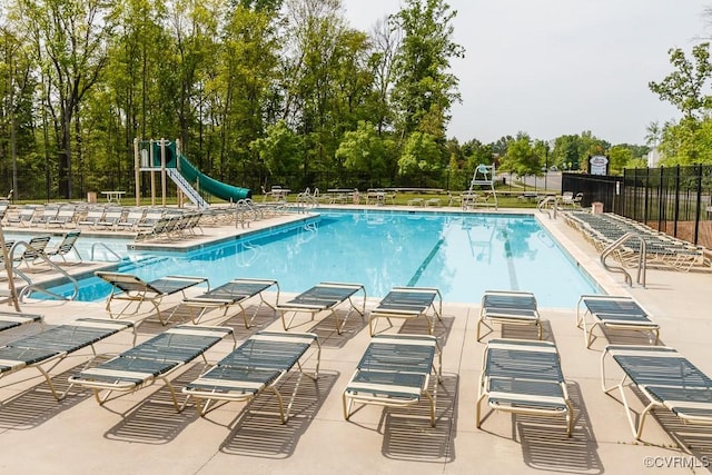 8013 Rutland Village Dr, Mechanicsville, VA 23116 - community pool featuring a water slide, a patio, and view of scattered trees