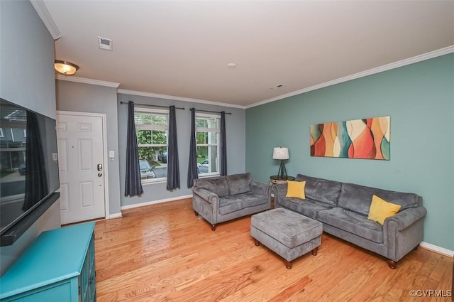 8013 Rutland Village Dr, Mechanicsville, VA 23116 - living room featuring light wood finished floors and crown molding