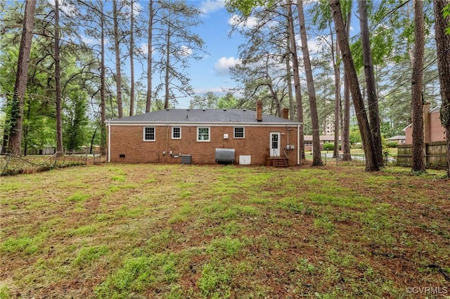 6808 Montauk Dr, Richmond, VA 23225 - back of property featuring a chimney, heating fuel, and brick siding