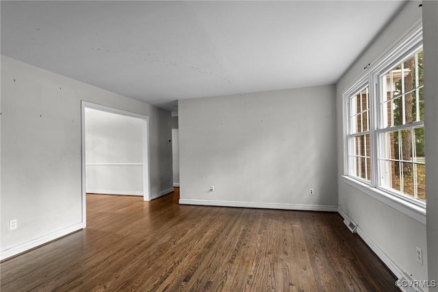 6808 Montauk Dr, Richmond, VA 23225 - unfurnished room featuring dark wood-style floors and plenty of natural light