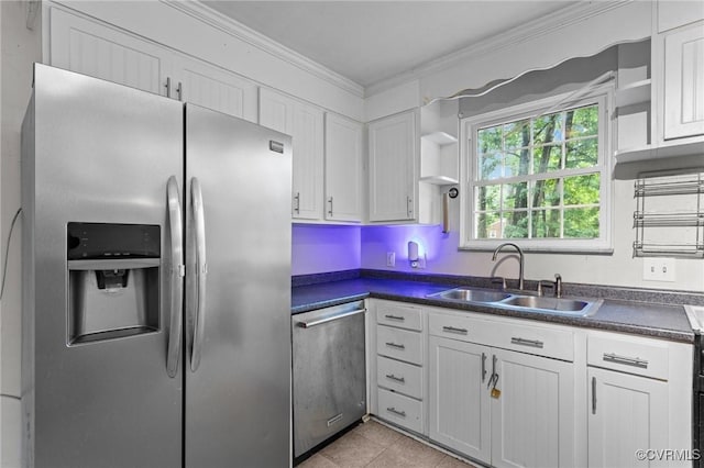 6808 Montauk Dr, Richmond, VA 23225 - kitchen with appliances with stainless steel finishes, dark countertops, white cabinets, and ornamental molding