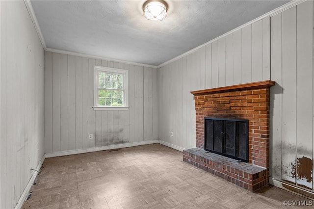 6808 Montauk Dr, Richmond, VA 23225 - unfurnished living room featuring a brick fireplace, crown molding, and wooden walls