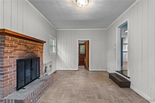 6808 Montauk Dr, Richmond, VA 23225 - unfurnished living room with a brick fireplace, ornamental molding, and wooden walls