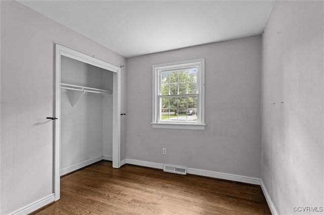 6808 Montauk Dr, Richmond, VA 23225 - unfurnished bedroom with wood finished floors and a closet