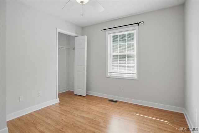 108 N Cedar Ave, Highland Springs, VA 23075 - unfurnished bedroom featuring light wood-style flooring, a closet, and a ceiling fan