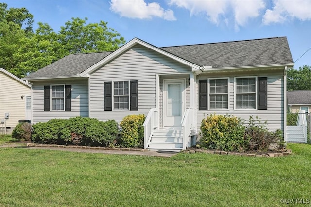 108 N Cedar Ave, Highland Springs, VA 23075 - view of front of house featuring a shingled roof and a front yard