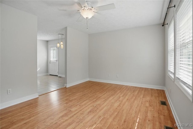 108 N Cedar Ave, Highland Springs, VA 23075 - empty room with light wood-style floors and ceiling fan