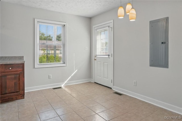 108 N Cedar Ave, Highland Springs, VA 23075 - foyer featuring electric panel, a textured ceiling, and light tile patterned floors