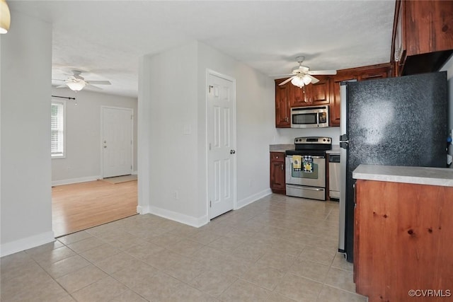 108 N Cedar Ave, Highland Springs, VA 23075 - kitchen with appliances with stainless steel finishes, ceiling fan, light countertops, and light tile patterned flooring