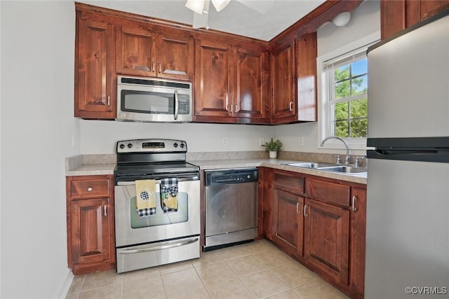 108 N Cedar Ave, Highland Springs, VA 23075 - kitchen with stainless steel appliances, light countertops, light tile patterned flooring, and a ceiling fan