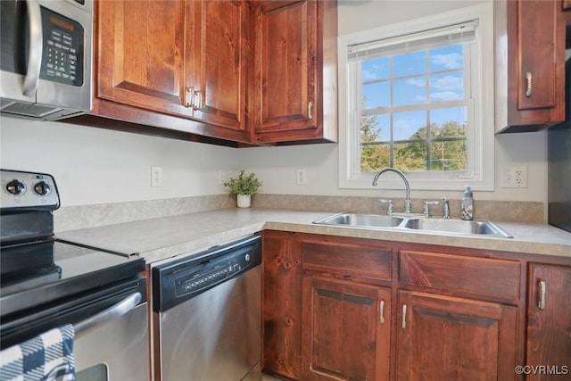 108 N Cedar Ave, Highland Springs, VA 23075 - kitchen featuring appliances with stainless steel finishes and light countertops