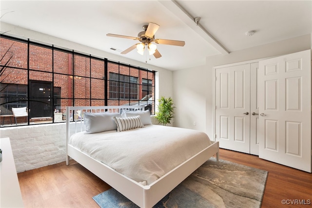 1716 Summit Ave Unit 18, Richmond, VA 23230 - bedroom with wood finished floors, multiple windows, a closet, beamed ceiling, and ceiling fan