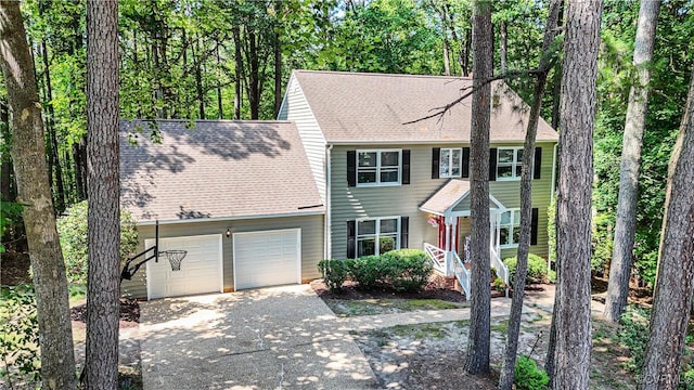 107 Oak Ridge Ct, Williamsburg, VA 23188 - colonial inspired home with asphalt driveway, a garage, and roof with shingles