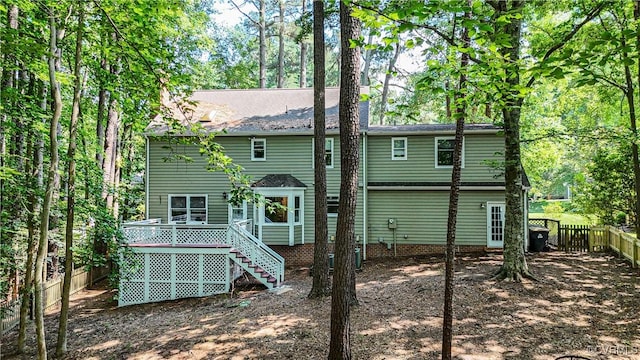 107 Oak Ridge Ct, Williamsburg, VA 23188 - back of house featuring a fenced backyard, a deck, stairs, and a shingled roof