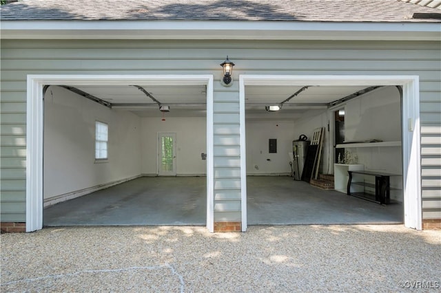 107 Oak Ridge Ct, Williamsburg, VA 23188 - garage with driveway, electric panel, and a garage door opener