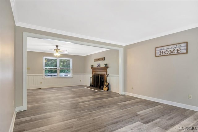 107 Oak Ridge Ct, Williamsburg, VA 23188 - unfurnished living room featuring crown molding, wood finished floors, a ceiling fan, and a fireplace with raised hearth