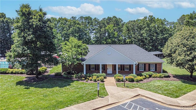107 Oak Ridge Ct, Williamsburg, VA 23188 - greek revival inspired property with covered porch, a front yard, and brick siding