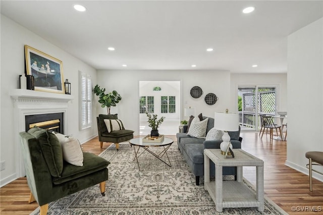 6030 Pond Place Way, Mechanicsville, VA 23111 - living area featuring plenty of natural light, recessed lighting, wood finished floors, and a fireplace