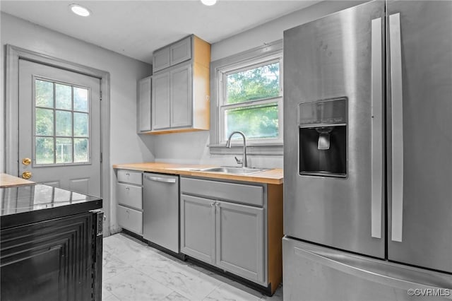 4123 Bremner Blvd, Henrico, VA 23228 - kitchen with stainless steel appliances, light marble finish flooring, gray cabinetry, wooden counters, and recessed lighting