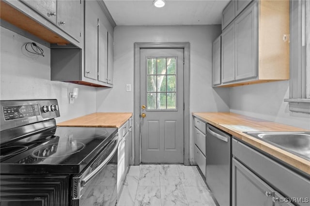4123 Bremner Blvd, Henrico, VA 23228 - kitchen featuring stainless steel appliances, gray cabinets, light marble finish floors, wood counters, and recessed lighting