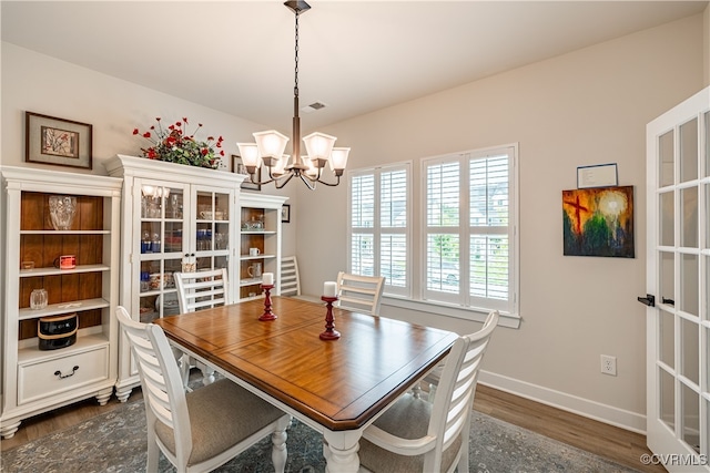 18149 Sagamore Dr, Moseley, VA 23120 - dining room with a chandelier and dark wood-type flooring