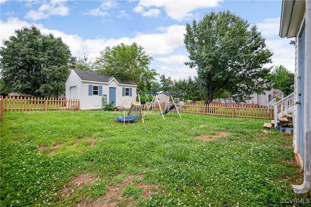 9220 Brocket Dr, Midlothian, VA 23112 - fenced backyard featuring a playground and an outbuilding