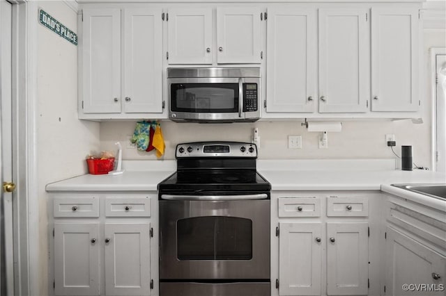 9220 Brocket Dr, Midlothian, VA 23112 - kitchen with appliances with stainless steel finishes, white cabinets, and light countertops