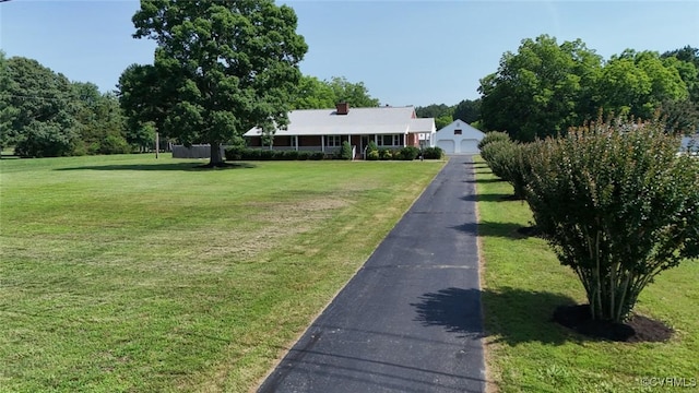 6010 Courthouse Rd, Prince George, VA 23875 - view of front of house featuring a garage and a front yard