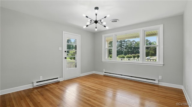 6010 Courthouse Rd, Prince George, VA 23875 - spare room with baseboard heating, a chandelier, and hardwood / wood-style flooring