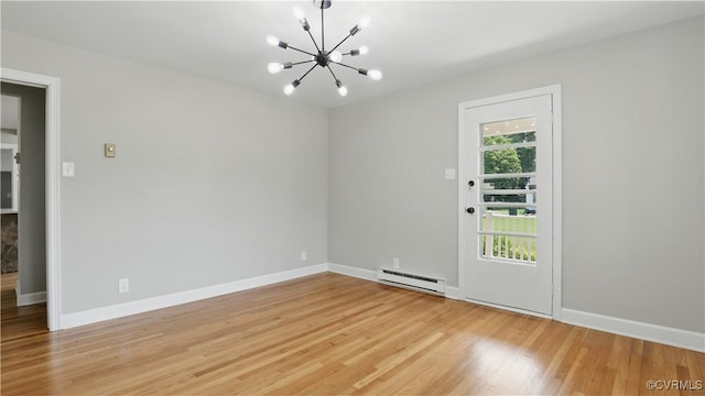 6010 Courthouse Rd, Prince George, VA 23875 - spare room with a baseboard heating unit, a chandelier, and light wood finished floors