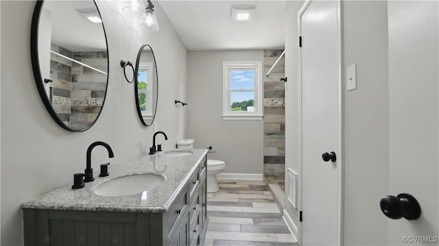 6010 Courthouse Rd, Prince George, VA 23875 - full bathroom with a tile shower, double vanity, and wood finished floors