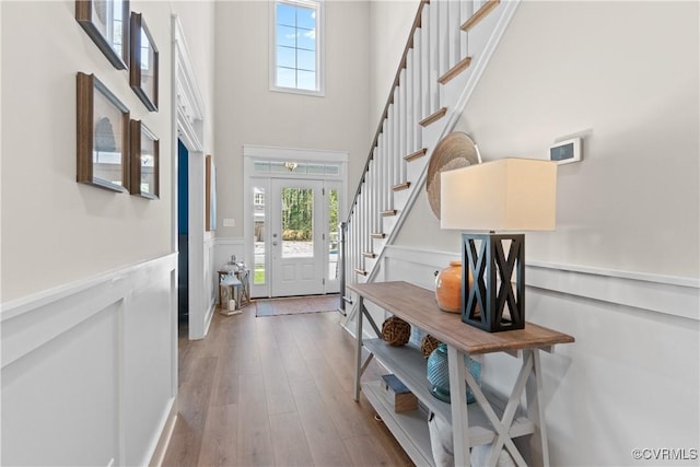 4606 Melbrook Way, Moseley, VA 23120 - foyer featuring stairway, a wainscoted wall, wood finished floors, a decorative wall, and a high ceiling