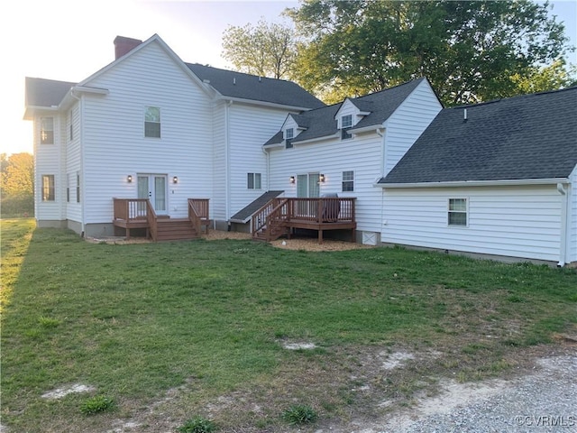 12309 Main St, Stony Creek, VA 23882 - rear view of house with a shingled roof, a wooden deck, a chimney, a lawn, and french doors