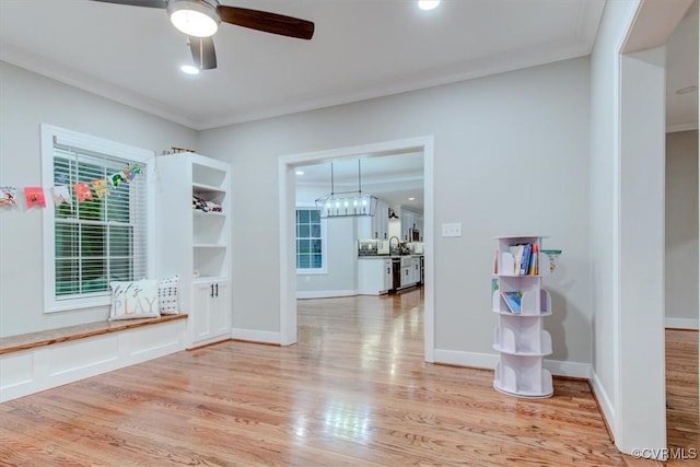 12309 Main St, Stony Creek, VA 23882 - empty room with light wood-type flooring, a ceiling fan, and crown molding