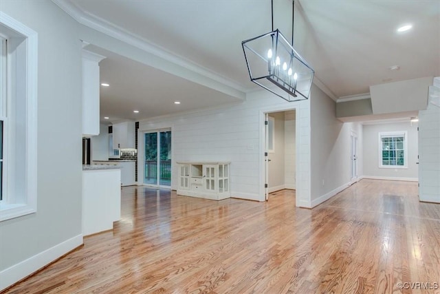 12309 Main St, Stony Creek, VA 23882 - unfurnished living room featuring crown molding, light wood-style flooring, recessed lighting, and a chandelier