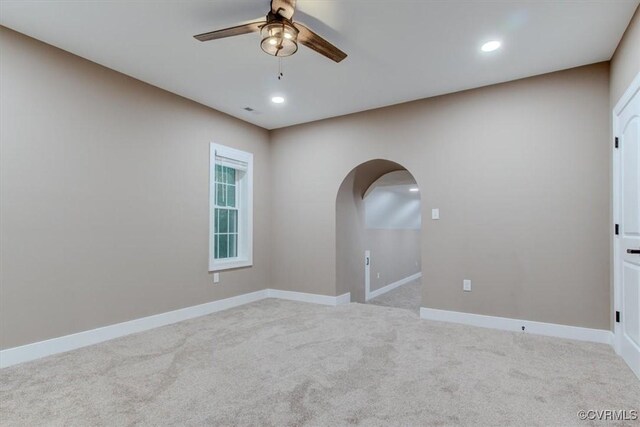 12309 Main St, Stony Creek, VA 23882 - empty room featuring ceiling fan, light carpet, arched walkways, and recessed lighting
