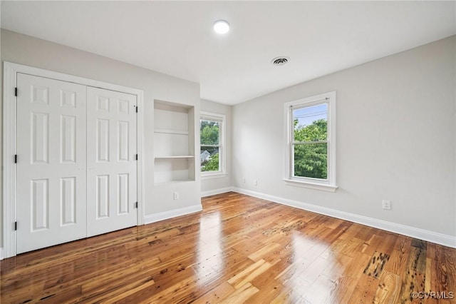 627 Colonial Ave, Colonial Heights, VA 23834 - unfurnished bedroom with wood finished floors and a closet