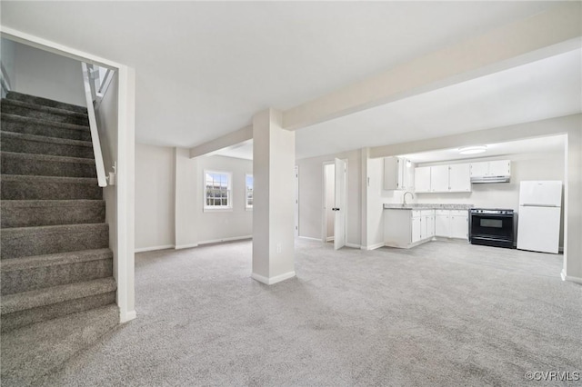 627 Colonial Ave, Colonial Heights, VA 23834 - unfurnished living room featuring light carpet and stairway
