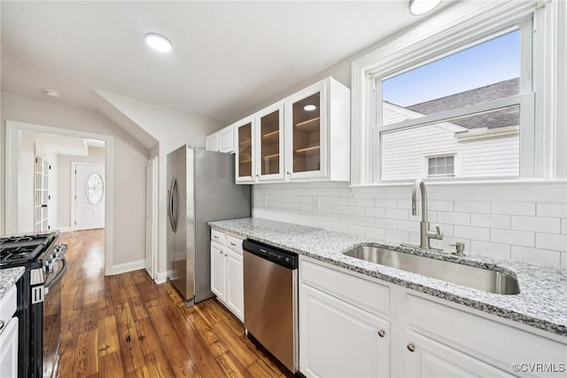 627 Colonial Ave, Colonial Heights, VA 23834 - kitchen featuring stainless steel appliances, glass insert cabinets, backsplash, and white cabinetry