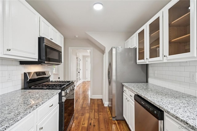 627 Colonial Ave, Colonial Heights, VA 23834 - kitchen featuring stainless steel appliances, white cabinets, dark wood finished floors, glass insert cabinets, and decorative backsplash